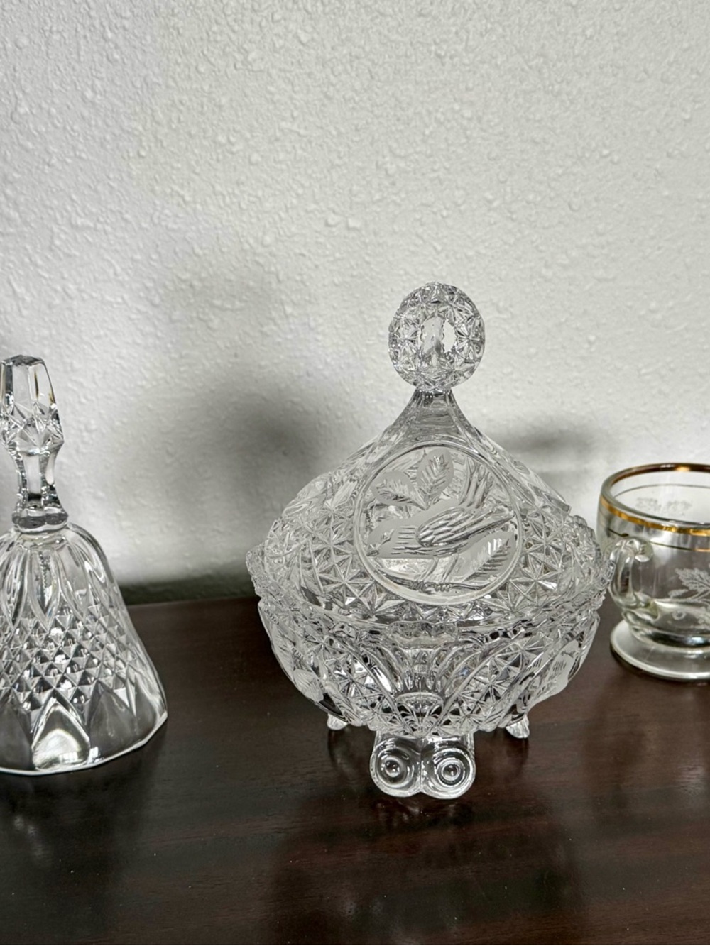 Cut Crystal Covered Dish (German), Cut Crystal Bell, and Etched Glass Sugar Bowl